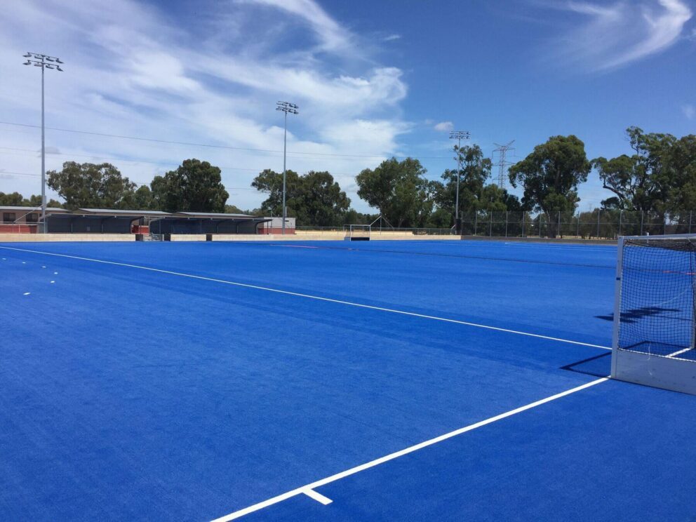 View of a Porter project, a blue hockey turf at Guildford Grammar