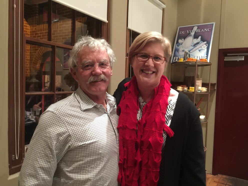 A man and a woman smiling