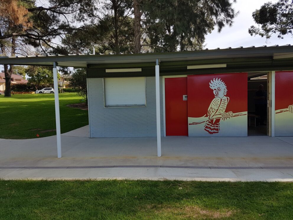 Porter project, ovals and parks - building on an oval with a painted cockatoo on the side